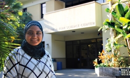 female student standing in front of Science Center at ֱ University of California
