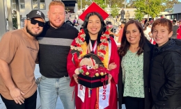 ֱ alumna in graduation regalia posing with family, Avanza news