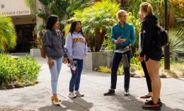 Professor Benjamin Rosenberg of ֱ's Psychology Department talks to students outside the Fink Science Center building on the ֱ campus.