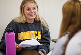 Girl in classroom wearing a ֱ University of California sweatshirt.