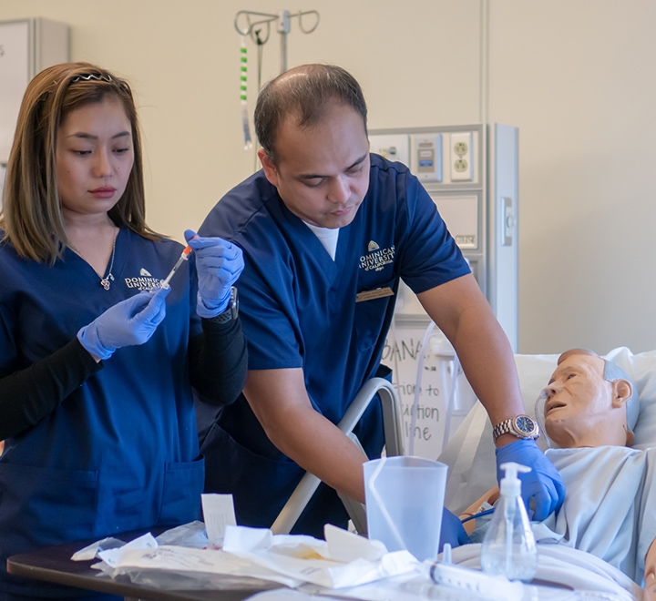 Two students in ֱ's nursing simulation lab.